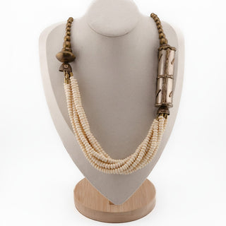 Reserved Grace vintage multi-strand cream beaded necklace with textured brass accents on a display bust