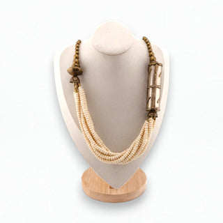 Reserved Grace vintage multi-strand cream beaded necklace with textured brass accents on a display bust