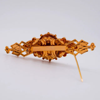 Reserved Grace vintage goldtone bar pin showing the back clasp mechanism and intricate metalwork detail