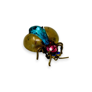 Reserved Grace vintage Czech bug brooch featuring a blue cabochon, pink rhinestone, and metallic insect design.