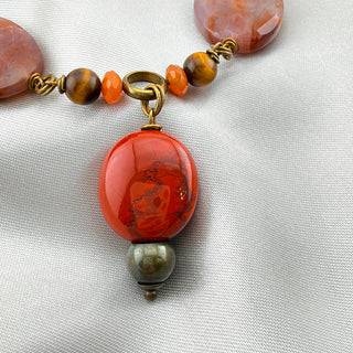 Reserved Grace vintage statement necklace featuring red jasper, smoky quartz, and brass accents on a white fabric base.