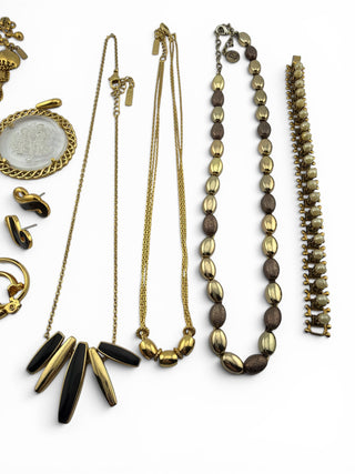 Reserved Grace vintage gold-tone jewelry set featuring necklaces, earrings, and a pearl-embellished bracelet.