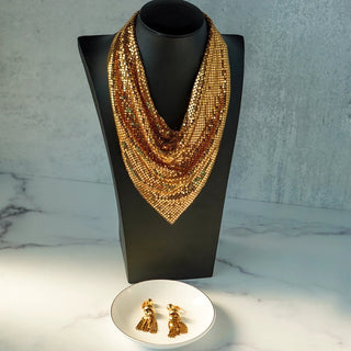 Reserved Grace vintage Whiting & Davis gold mesh necklace and tassel clip earring set on a black display bust