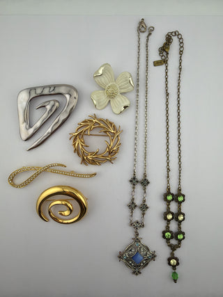 Reserved Grace vintage jewelry collection featuring assorted gold and silver tone brooches and two crystal necklaces.