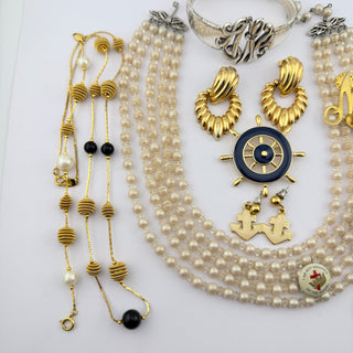 Reserved Grace vintage jewelry set featuring faux pearl necklaces, gold-tone hoops, nautical charms, and silver cuff.