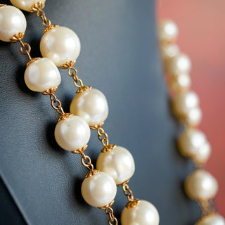 Reserved Grace vintage Marvella necklace featuring lustrous faux pearls linked by gold-tone metal on a display bust.