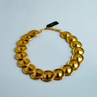 Reserved Grace vintage Monet necklace featuring a sequence of matte gold-tone metal disks on a 19.5-inch chain.