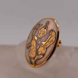 Reserved Grace vintage 1985 Norwegian hand-painted ceramic brooch with grey, white, and abstract gold luster glaze.