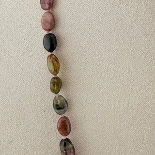 Reserved Grace vintage tourmaline bead necklace featuring multi-color faceted gemstones on a neutral display background.