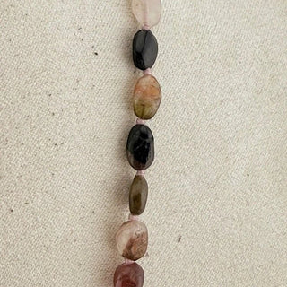 Reserved Grace vintage tourmaline bead necklace featuring faceted multi-color gemstone beads on a light fabric background