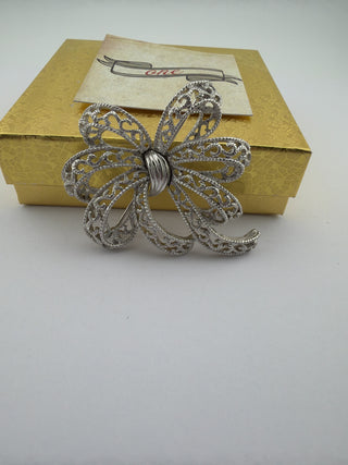Reserved Grace vintage Trifari silver-tone filigree bow brooch with intricate lacy loops and polished center band