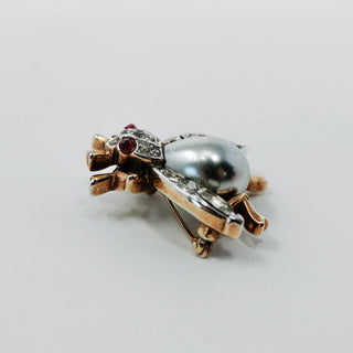 Reserved Grace vintage Trifari insect brooch with a silver-gray cabochon body and sparkling rhinestone accents.