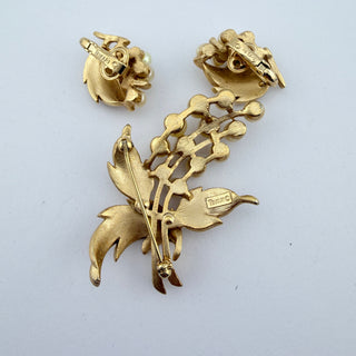 Reserved Grace vintage Trifari brooch and clip-on earring set back view showing gold-tone metal and signature stamps.