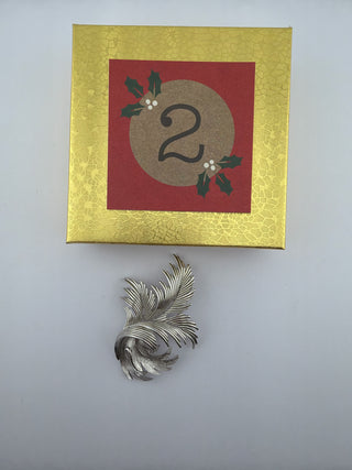 Reserved Grace vintage Trifari silver-tone leaf brooch with brushed metal texture and intricate feather design