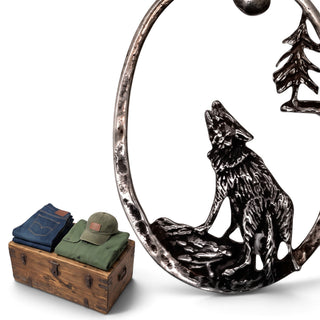Reserved Grace vintage sterling silver oval pendant featuring a detailed wolf howling at the moon in a forest scene.