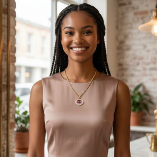 Reserved Grace model wearing a vintage Nolan Miller reversible pink crystal pendant necklace with a gold-tone chain.