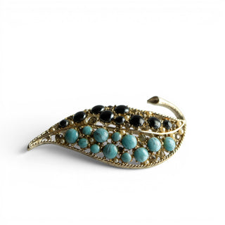 Reserved Grace vintage Coro leaf brooch featuring black and blue glass stones with clear rhinestones in gold-tone metal